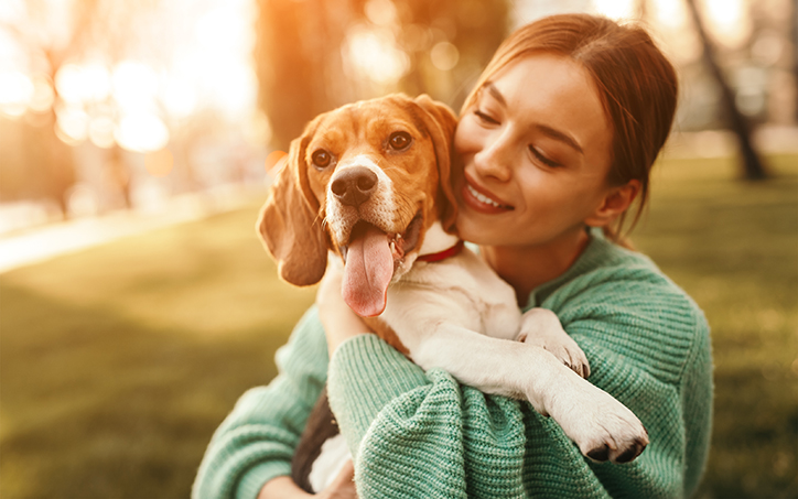 Woman hugging her dog photo